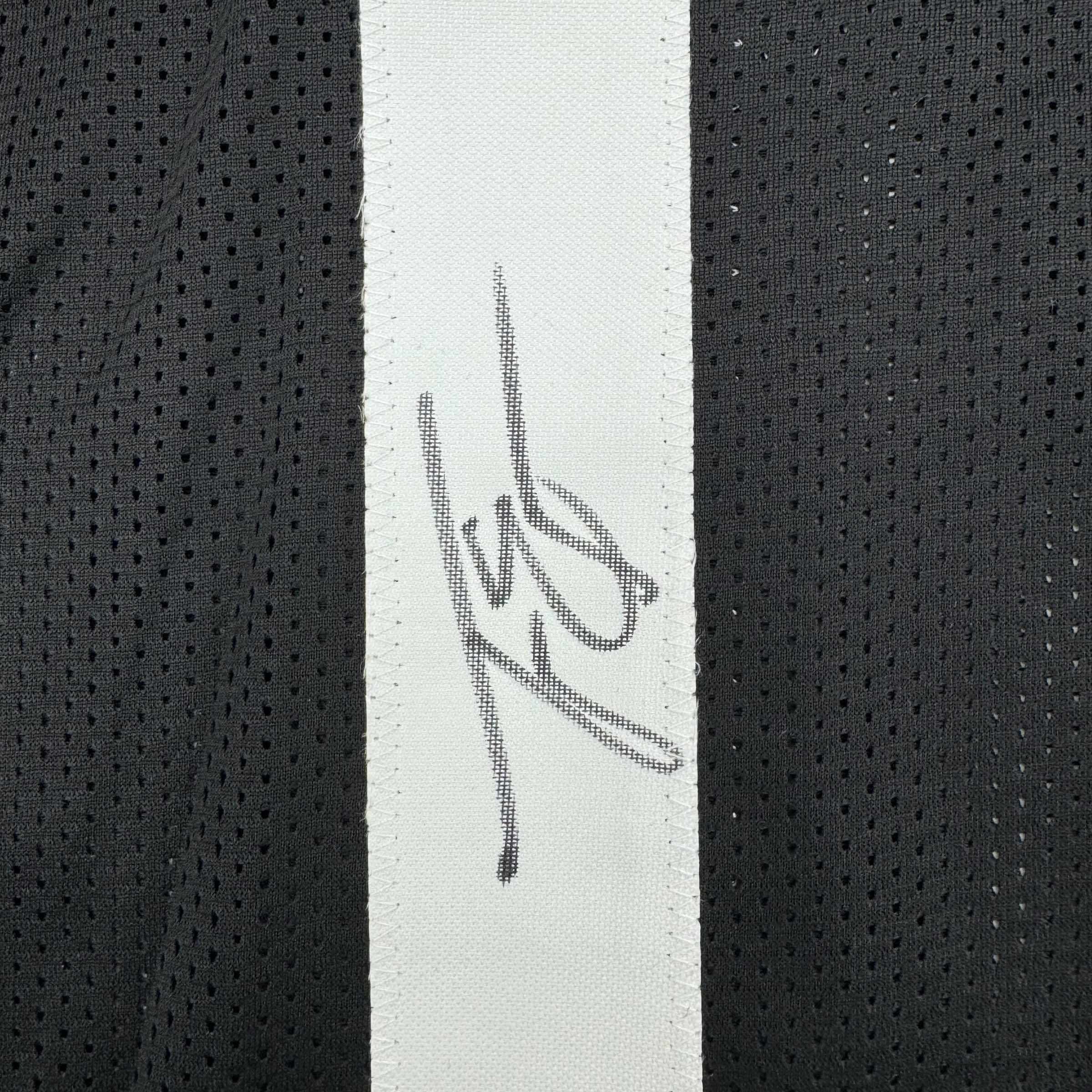 autographed-signed-travis-etienne-jr-jacksonville-black-football-jersey-beckett-bas-coa
