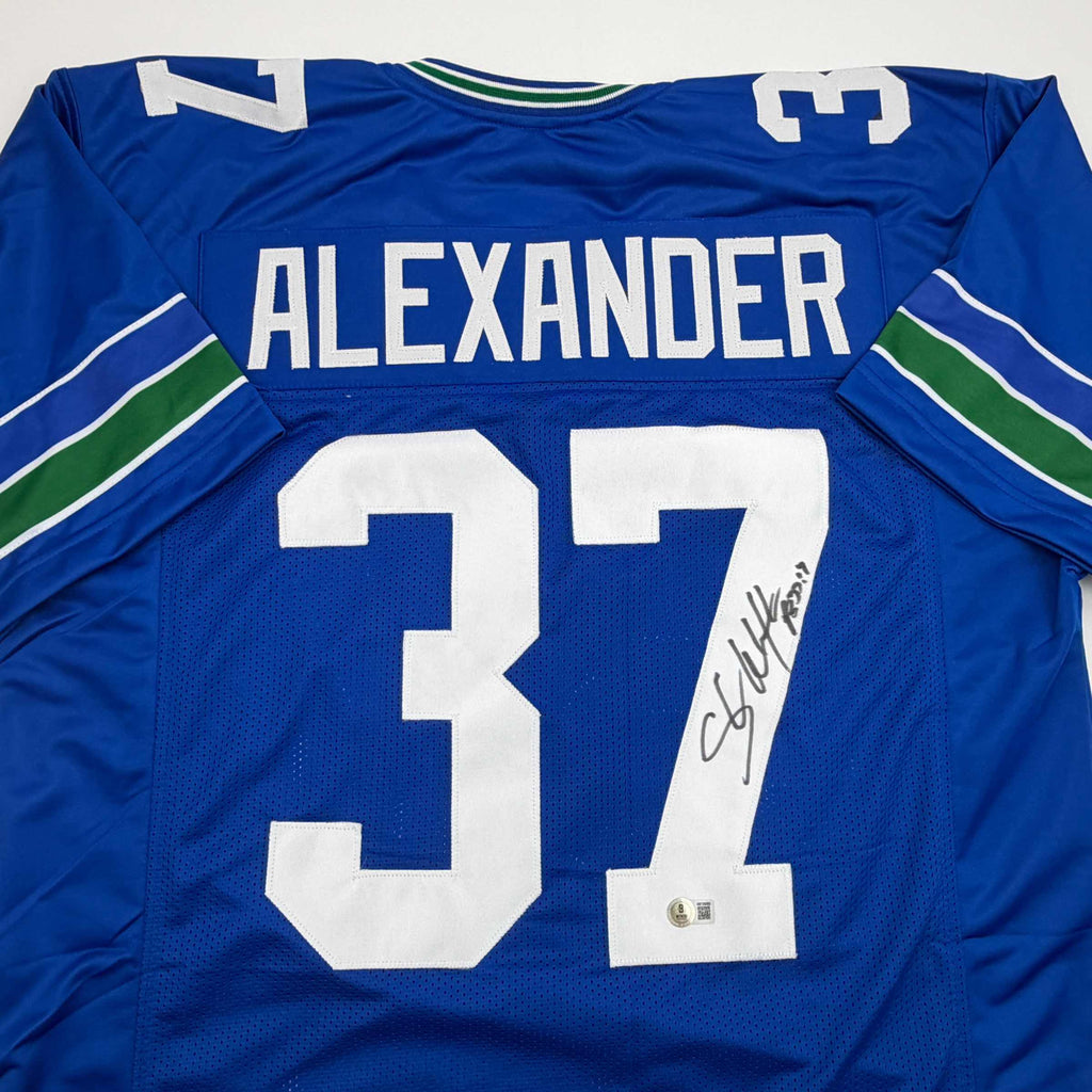 autographed-signed-shaun-alexander-seattle-blue-football-jersey-beckett-bas-coa
