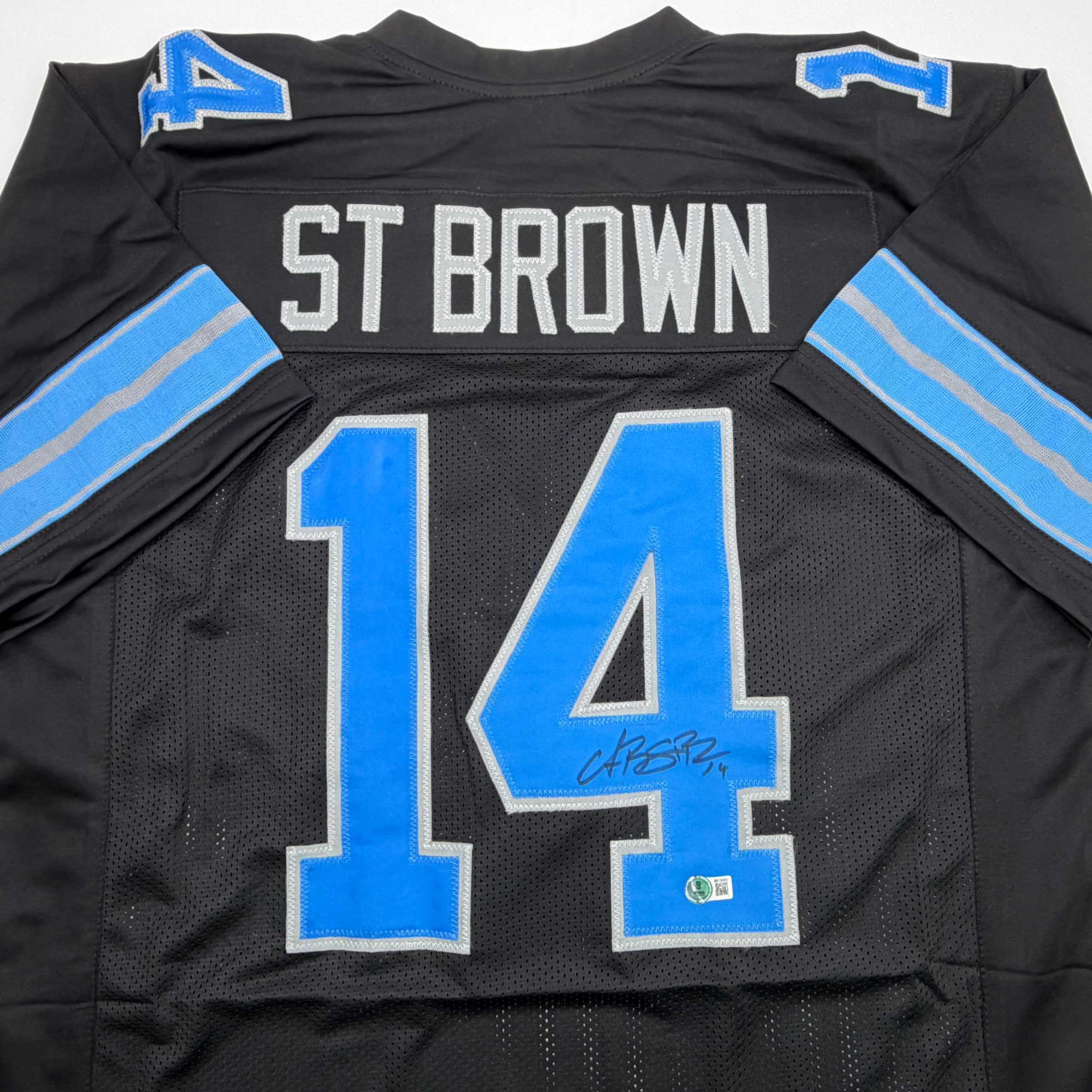 autographed-signed-amon-ra-st-brown-detroit-black-football-jersey-beckett-bas-coa