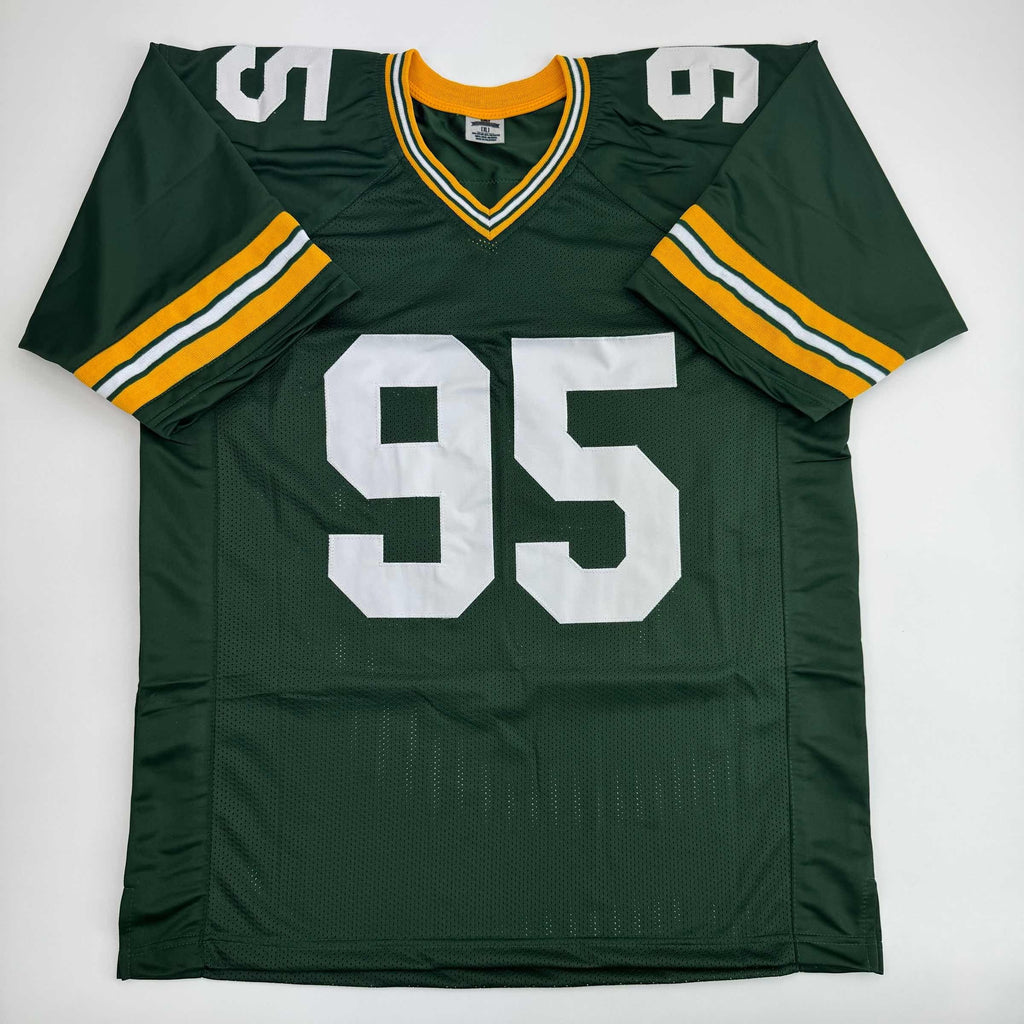 autographed-signed-devonte-wyatt-green-bay-green-football-jersey-jsa-coa