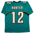 autographed-signed-travis-hunter-jacksonville-teal-retro-football-jersey-beckett-bas-coa