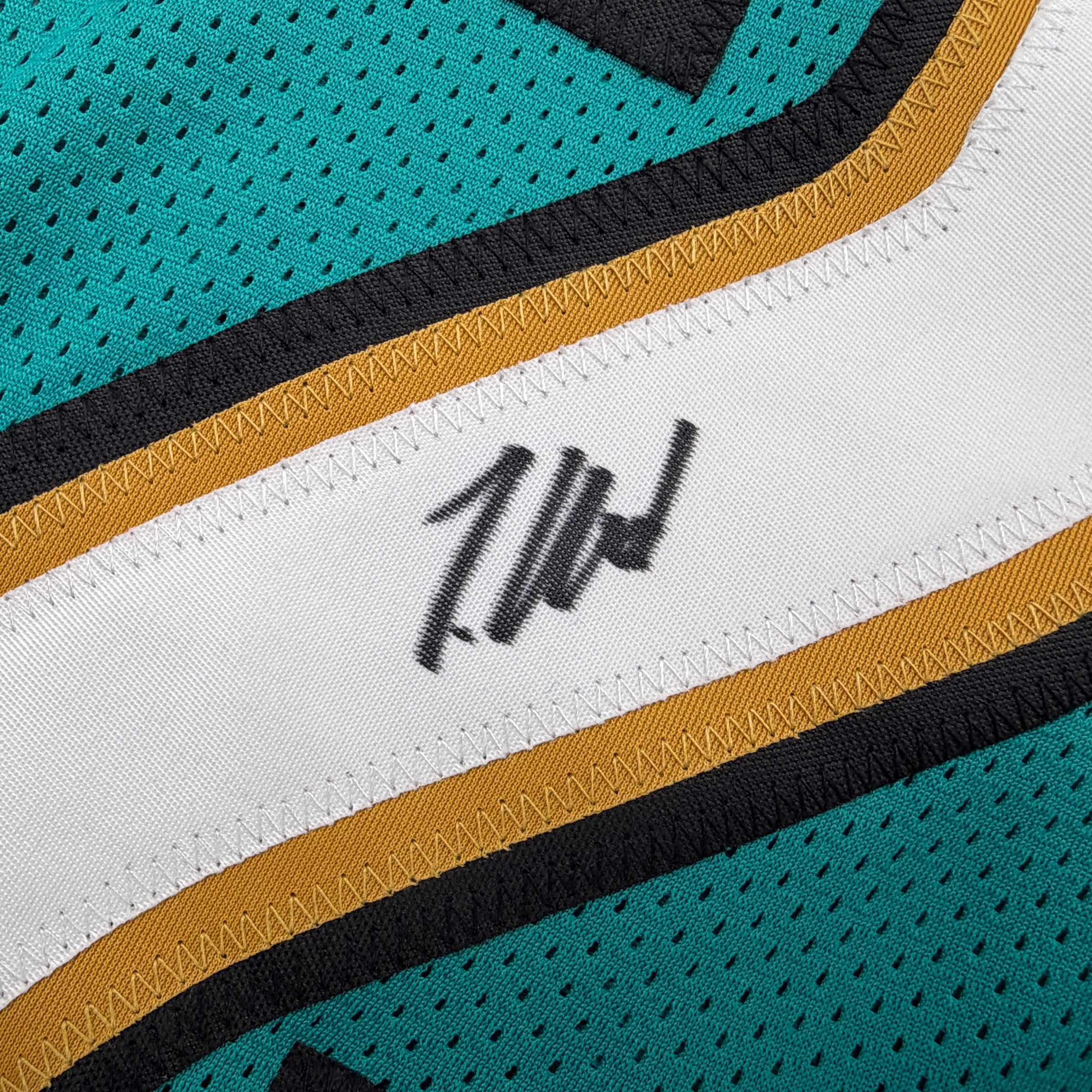 autographed-signed-travis-hunter-jacksonville-teal-retro-football-jersey-beckett-bas-coa