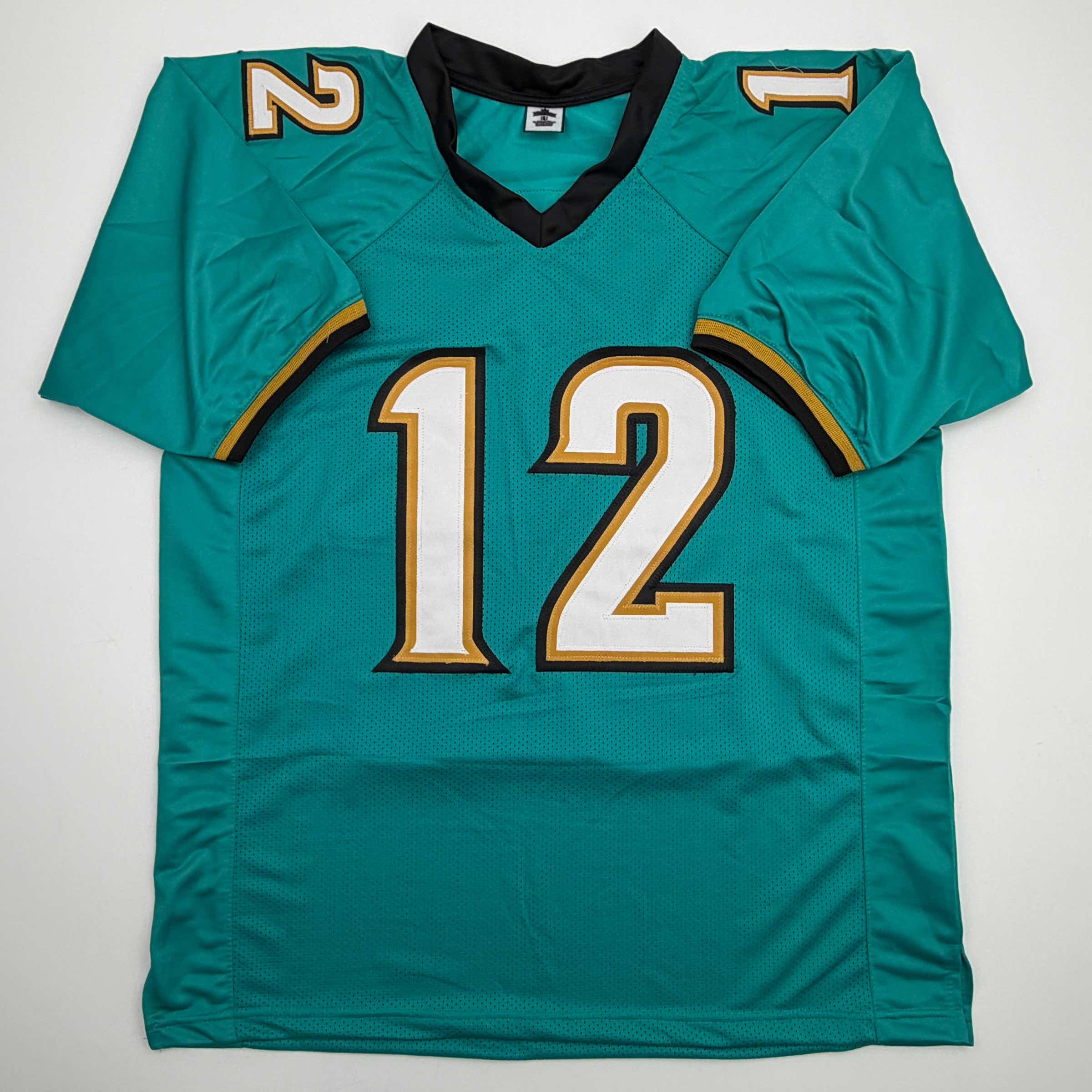 autographed-signed-travis-hunter-jacksonville-teal-retro-football-jersey-beckett-bas-coa