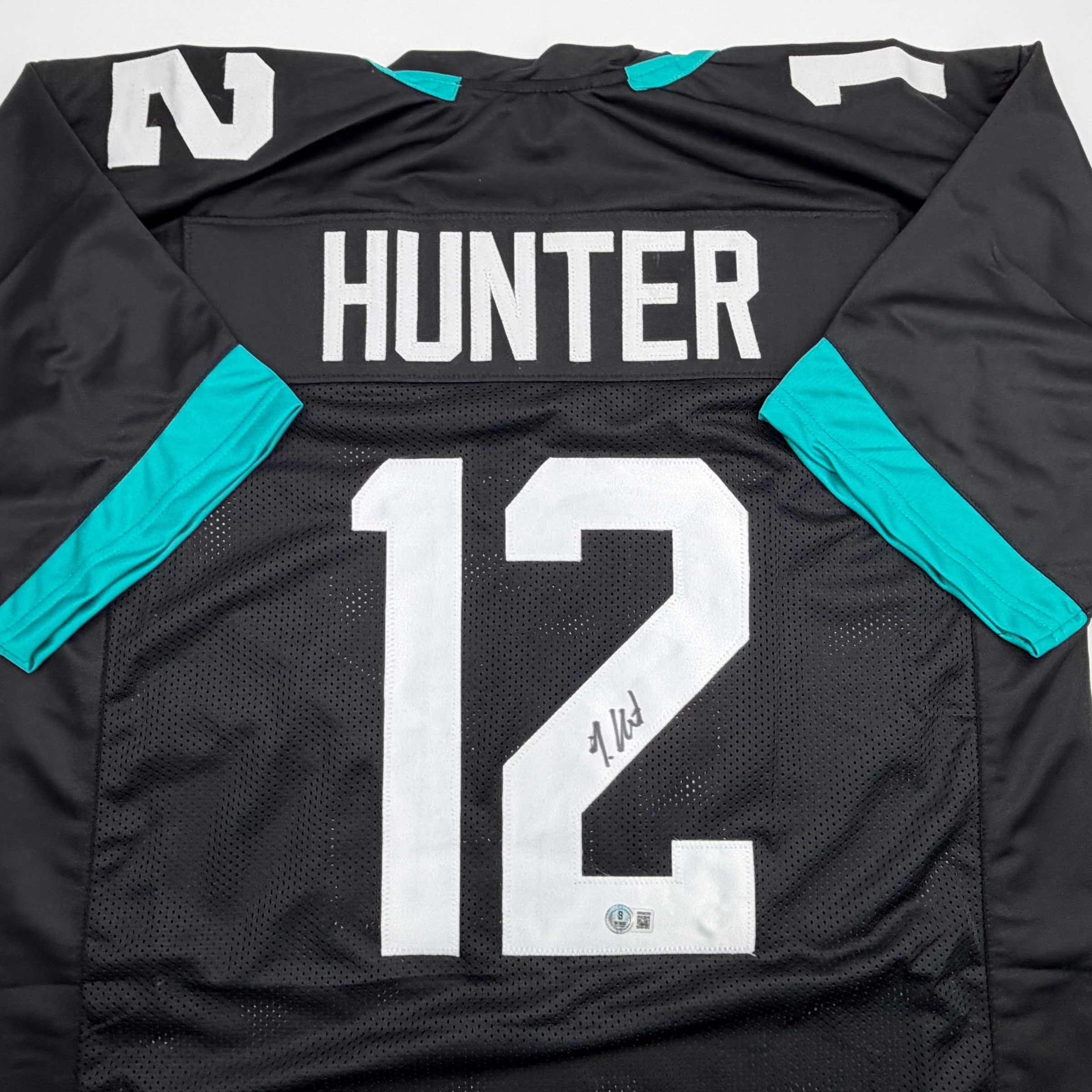 autographed-signed-travis-hunter-jacksonville-black-football-jersey-beckett-bas-coa