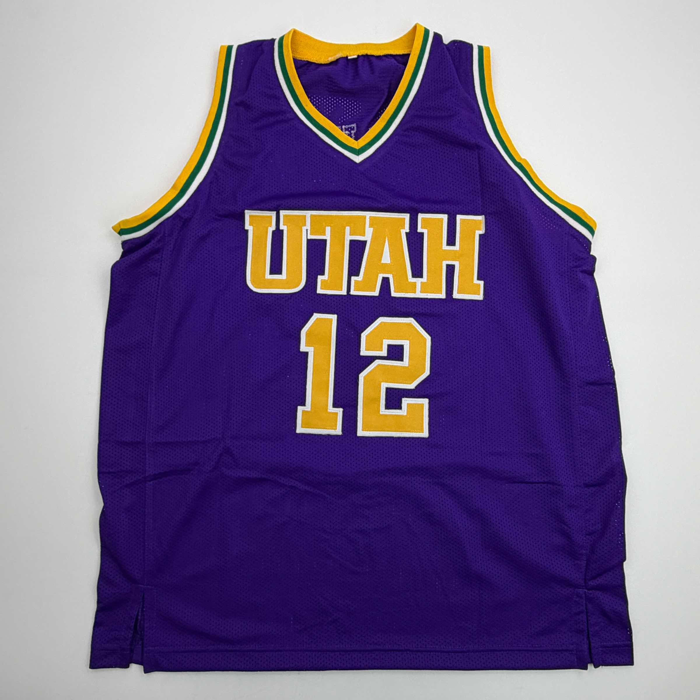 autographed-signed-john-stockton-utah-purple-basketball-jersey-beckett-bas-coa