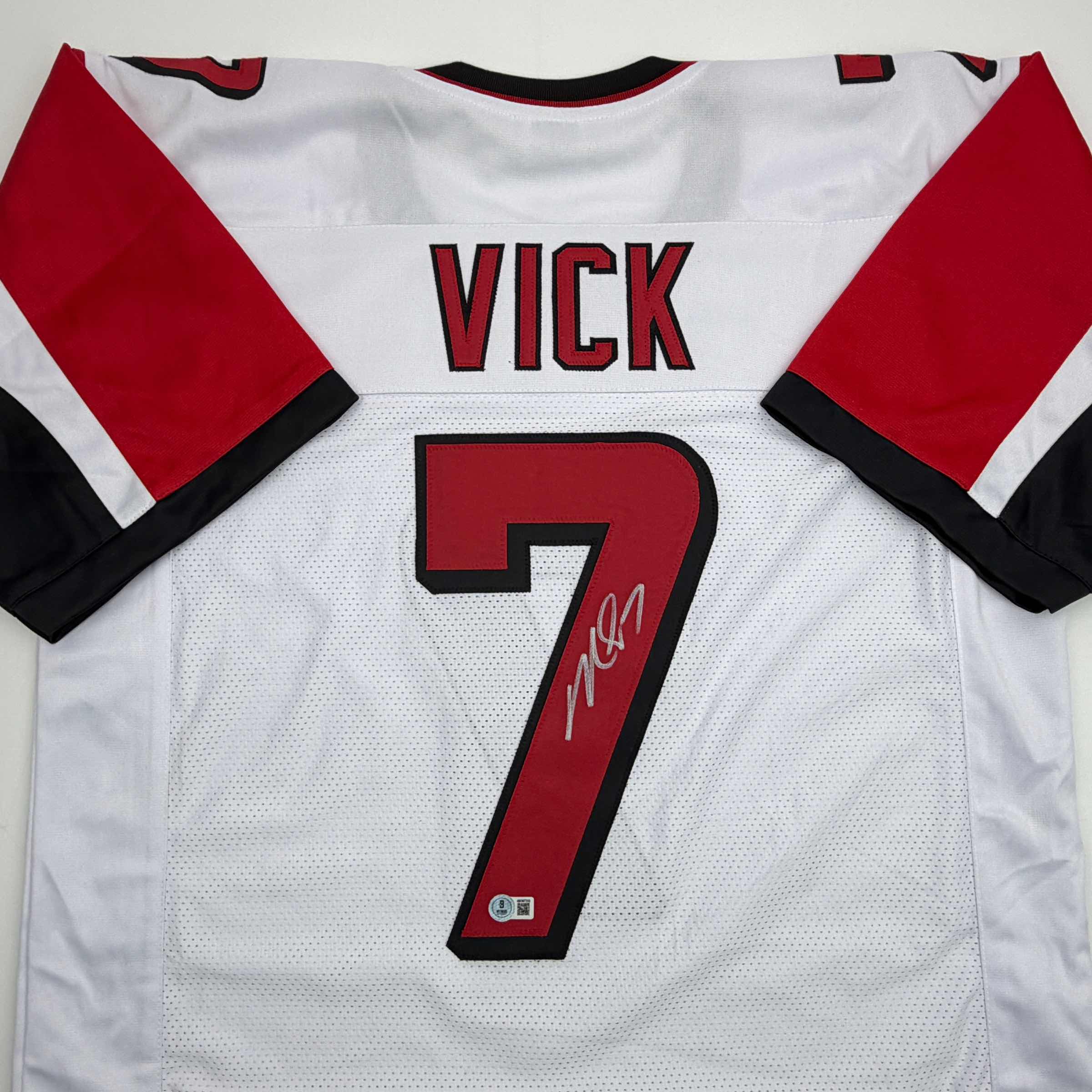 autographed-signed-michael-mike-vick-atlanta-white-football-jersey-beckett-bas-coa