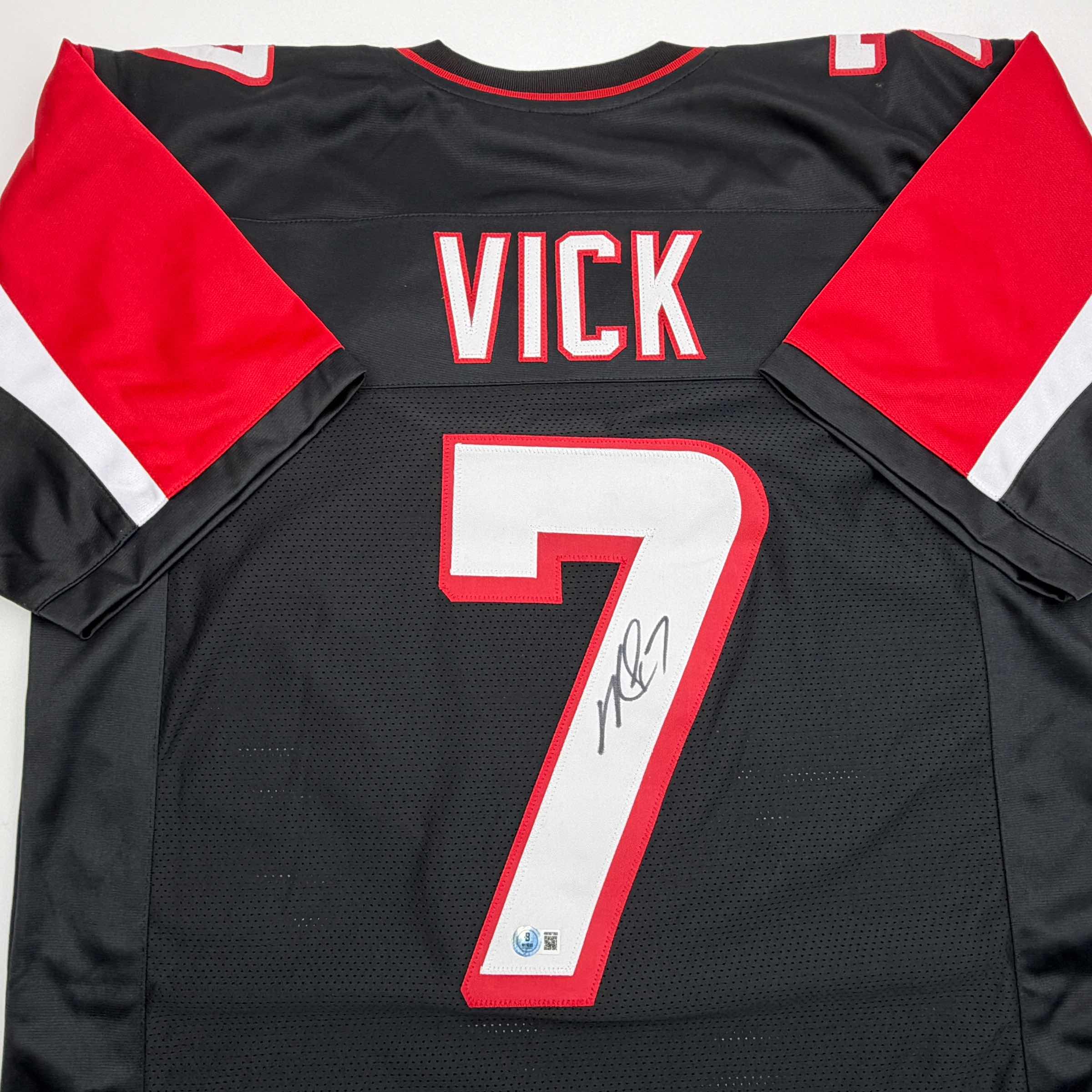 autographed-signed-michael-mike-vick-atlanta-black-football-jersey-beckett-bas-coa