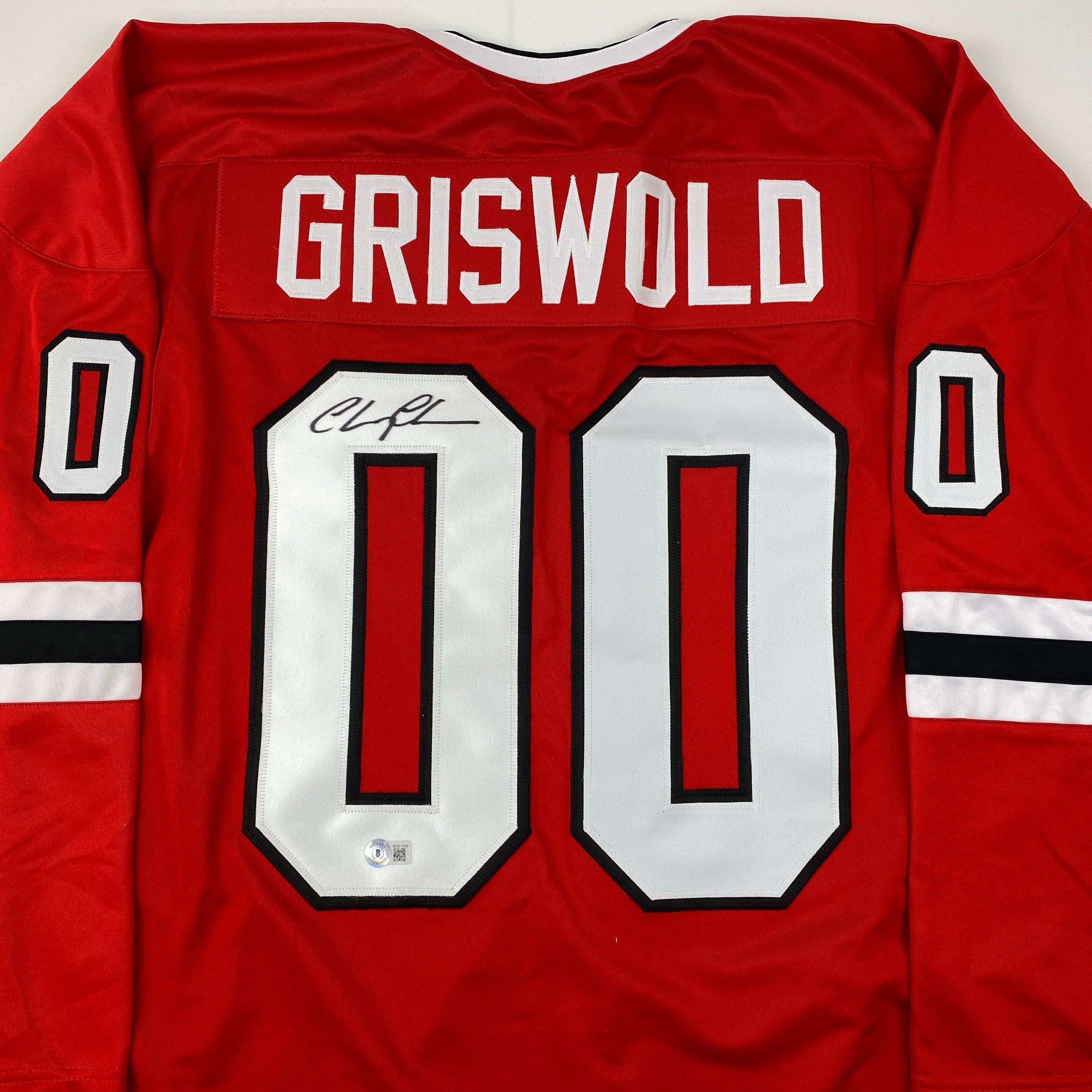 autographed-signed-chevy-chase-clark-griswold-christmas-vacation-movie-chicago-red-hockey-jersey-beckett-bas-coa