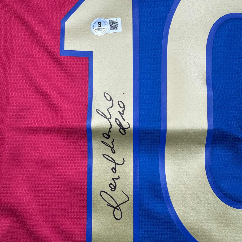 autographed-signed-ronaldinho-barcelona-blue-red-soccer-jersey-beckett-bas-coa-1