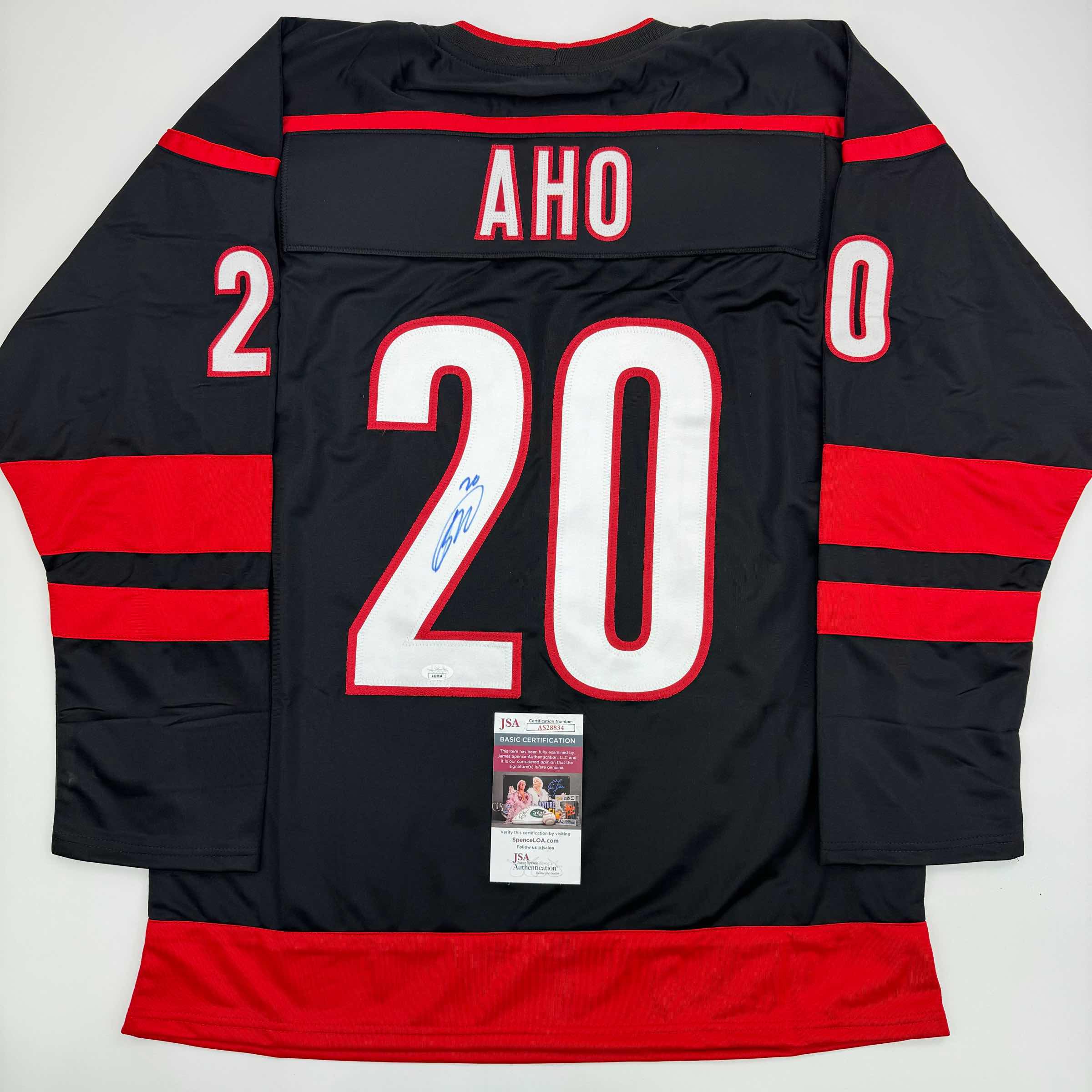 autographed-signed-sebastian-aho-carolina-black-hockey-jersey-jsa-coa