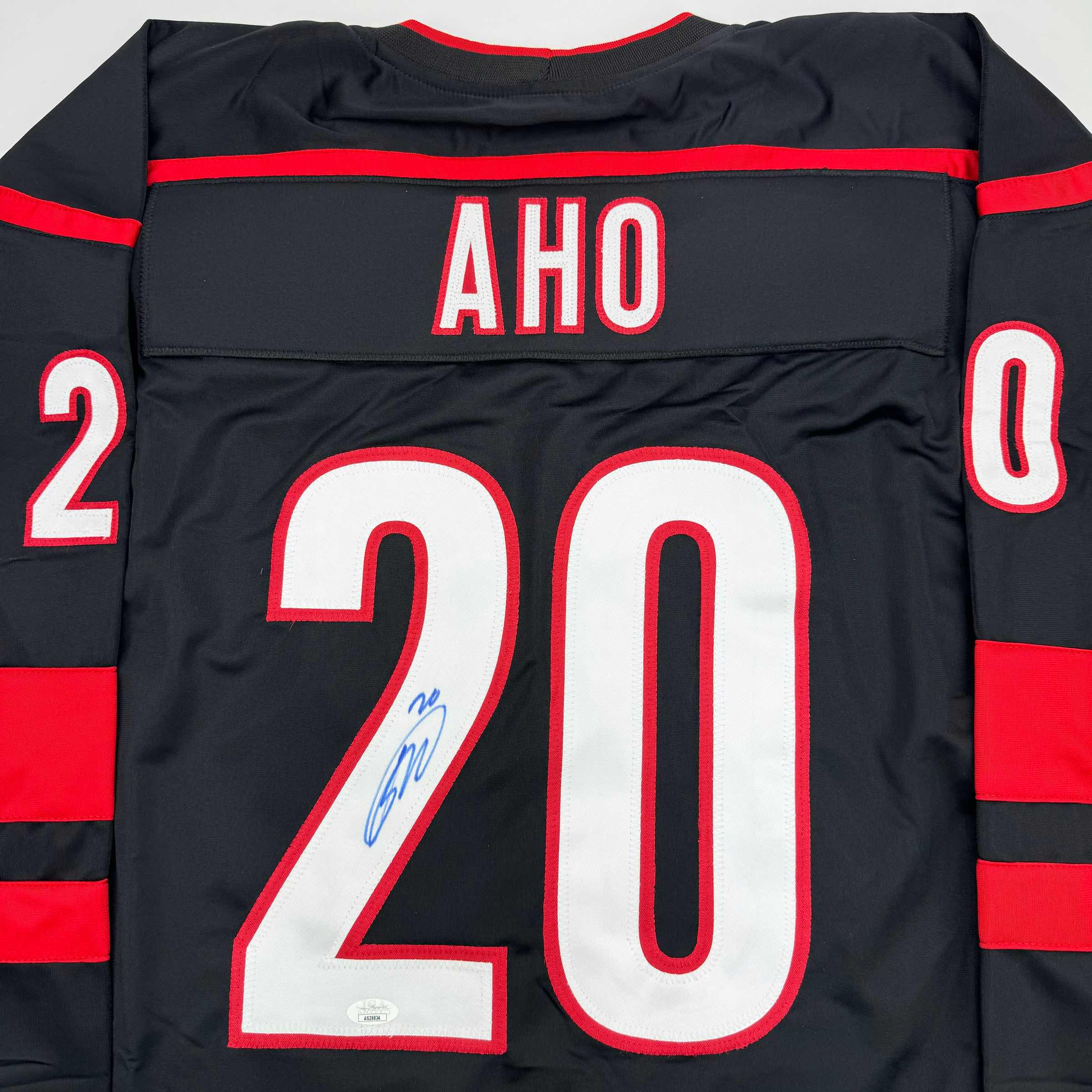 autographed-signed-sebastian-aho-carolina-black-hockey-jersey-jsa-coa