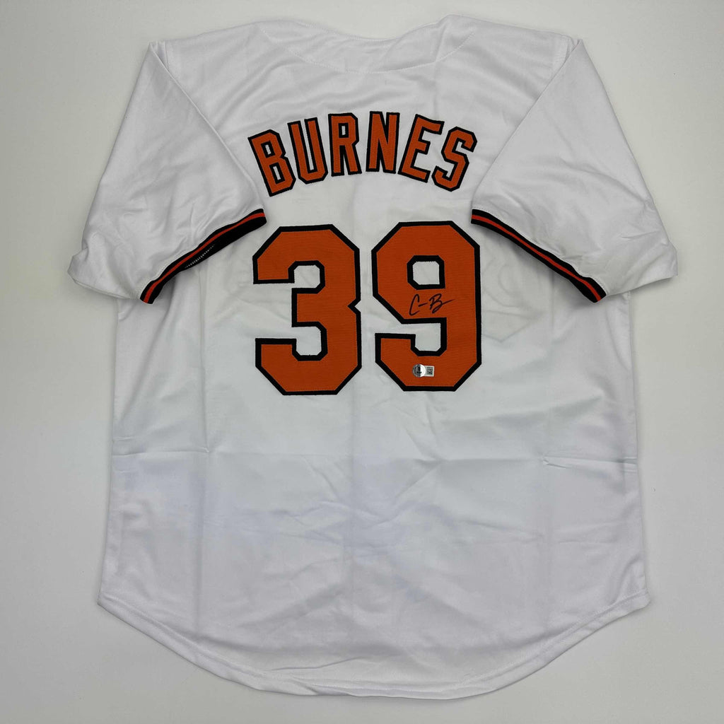 autographed-signed-corbin-burnes-baltimore-white-baseball-jersey-beckett-bas-coa