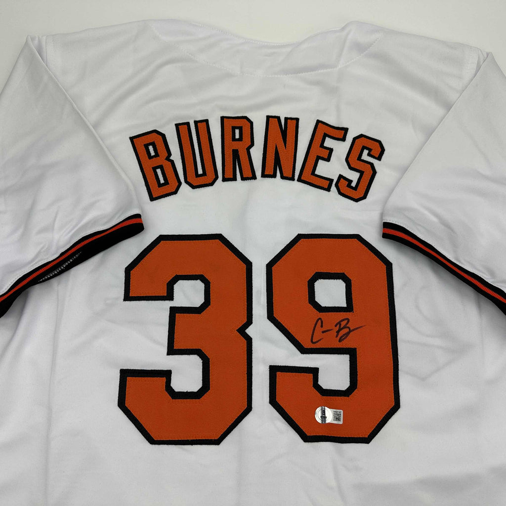 autographed-signed-corbin-burnes-baltimore-white-baseball-jersey-beckett-bas-coa