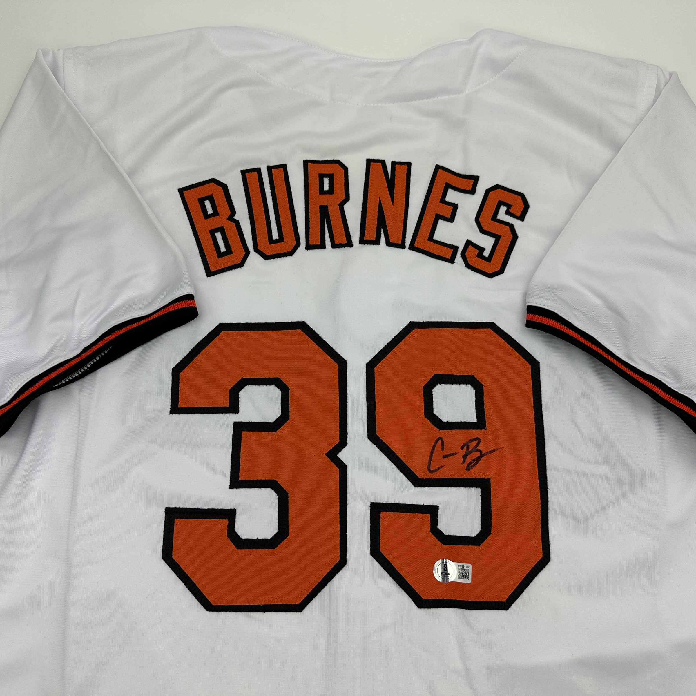 autographed-signed-corbin-burnes-baltimore-white-baseball-jersey-beckett-bas-coa