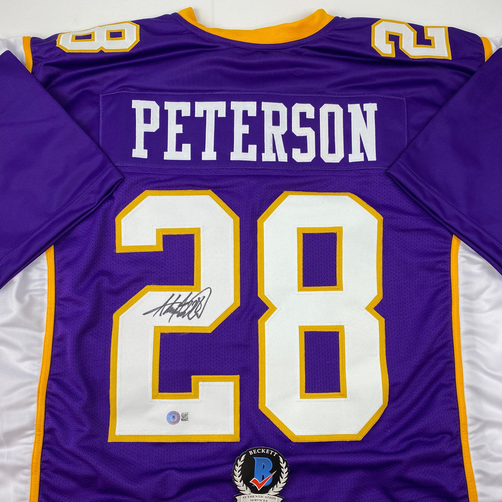 autographed-signed-adrian-peterson-minnesota-purple-football-jersey-beckett-bas-coa