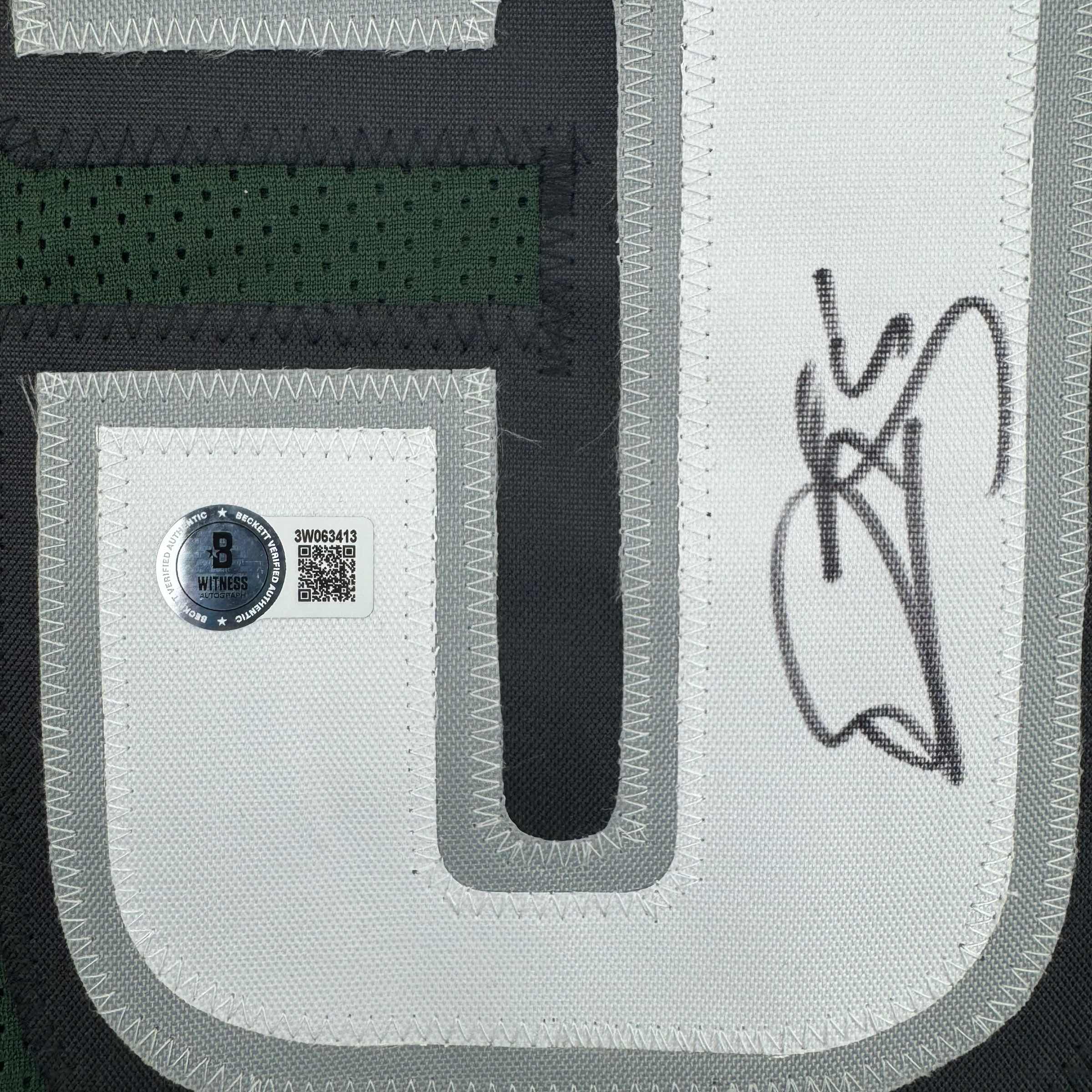autographed-signed-donovan-mcnabb-philadelphia-green-football-jersey-beckett-bas-coa