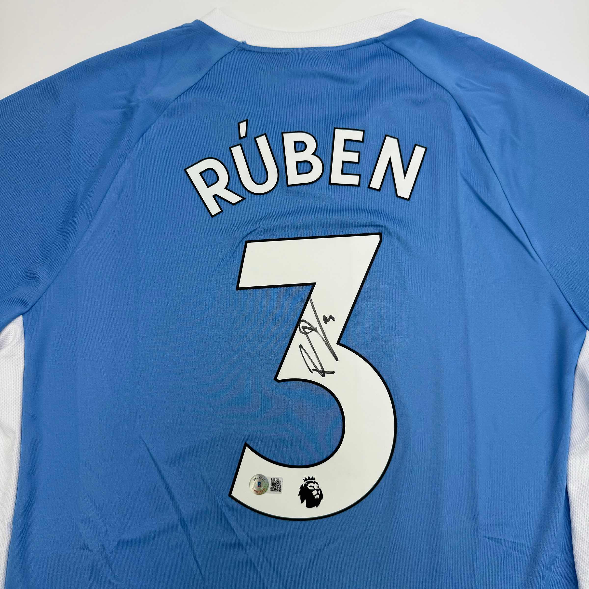 autographed-signed-ruben-dias-manchester-city-blue-soccer-futbol-jersey-beckett-bas-coa-2