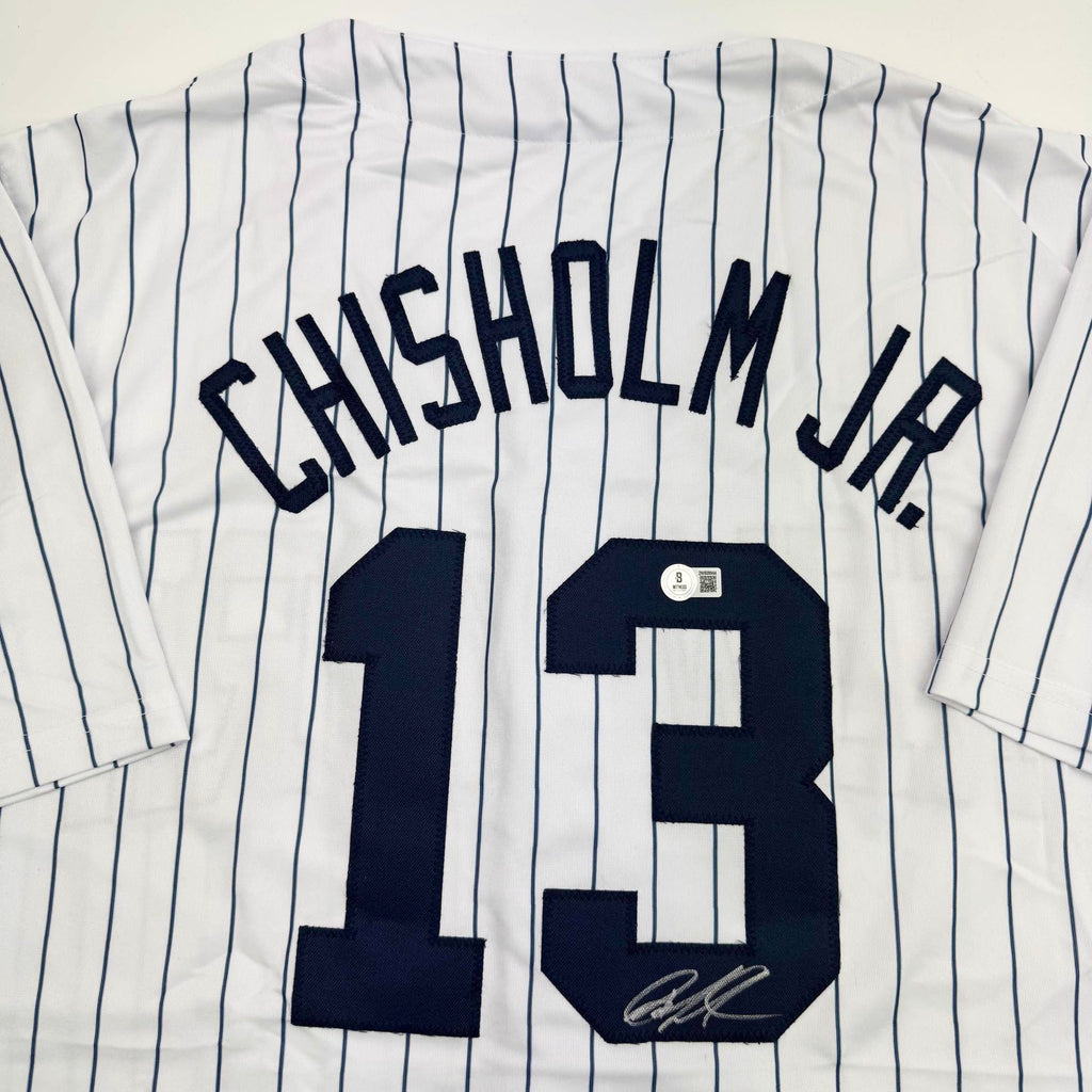 autographed-signed-jazz-chisholm-jr-new-york-pinstripe-baseball-jersey-beckett-bas-coa