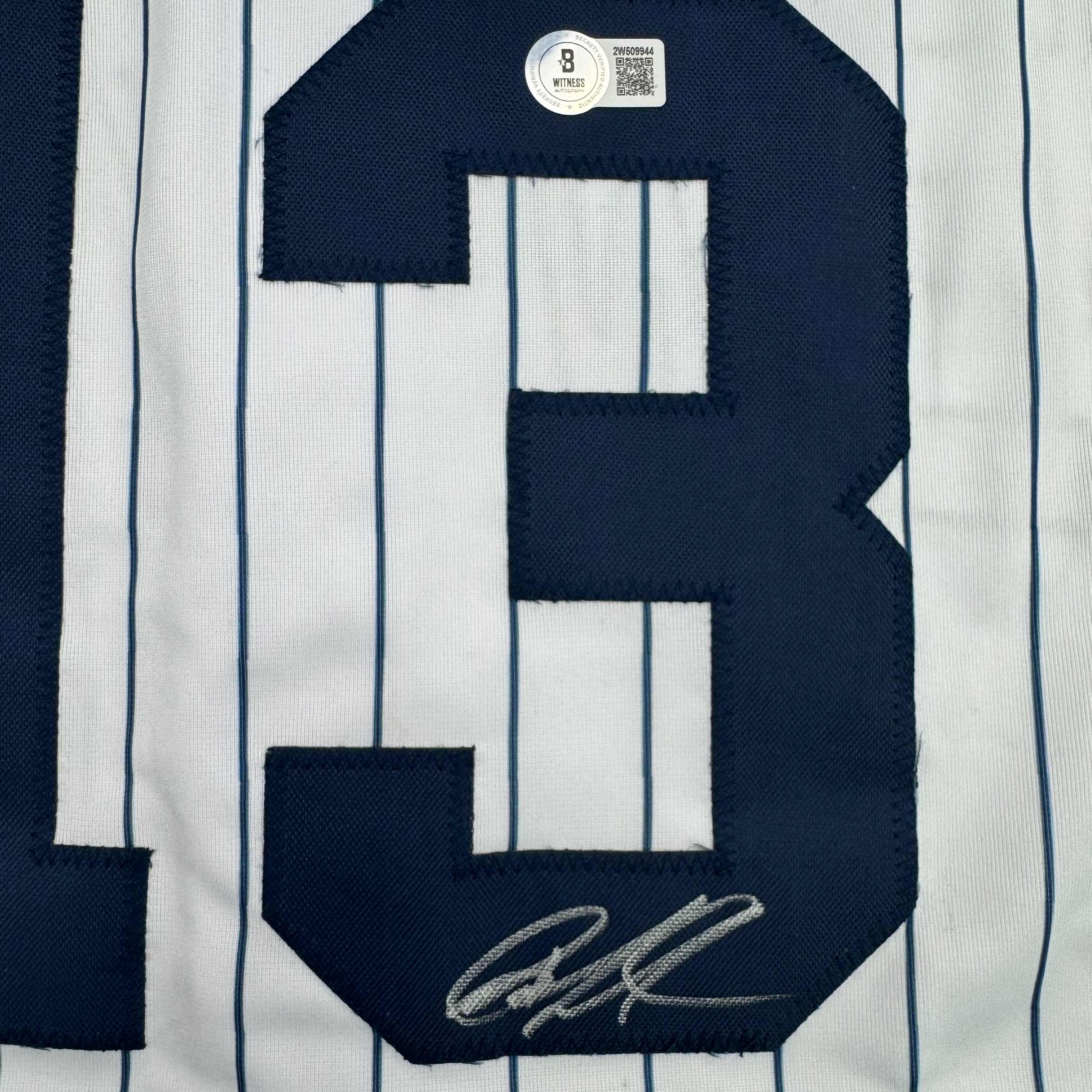 autographed-signed-jazz-chisholm-jr-new-york-pinstripe-baseball-jersey-beckett-bas-coa