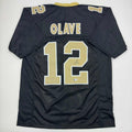 autographed-signed-chris-olave-new-orleans-black-football-jersey-beckett-bas-coa