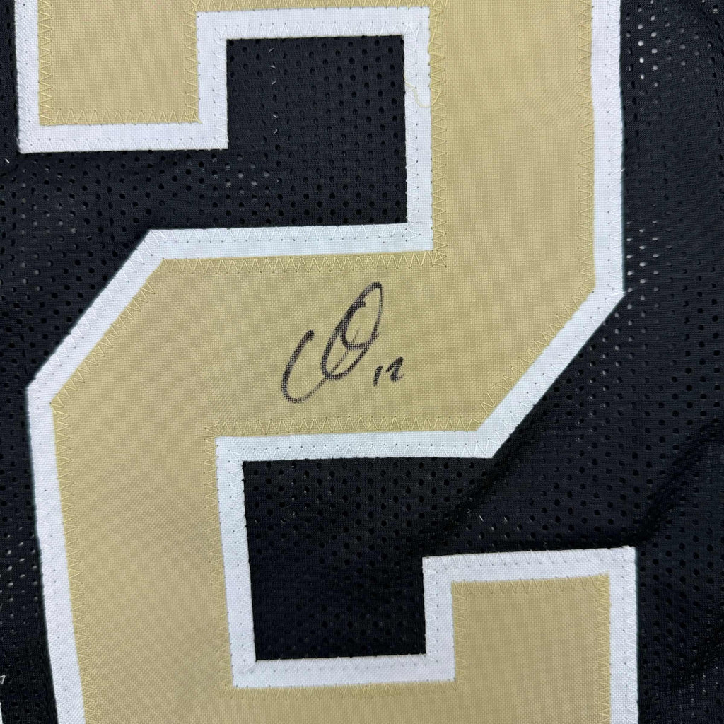 autographed-signed-chris-olave-new-orleans-black-football-jersey-beckett-bas-coa