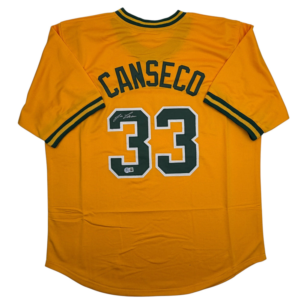 autographed-signed-jose-canseco-oakland-yellow-baseball-jersey-beckett-bas-coa