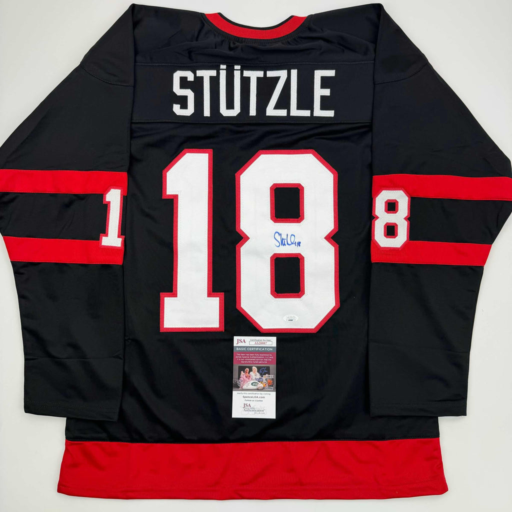 autographed-signed-tim-stutzle-ottawa-black-hockey-jersey-jsa-coa