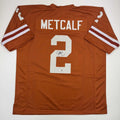autographed-signed-eric-metcalf-texas-orange-college-football-jersey-beckett-bas-coa