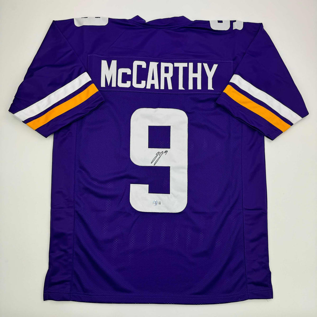 autographed-signed-j-j-jj-mccarthy-minnesota-purple-football-jersey-beckett-bas-coa