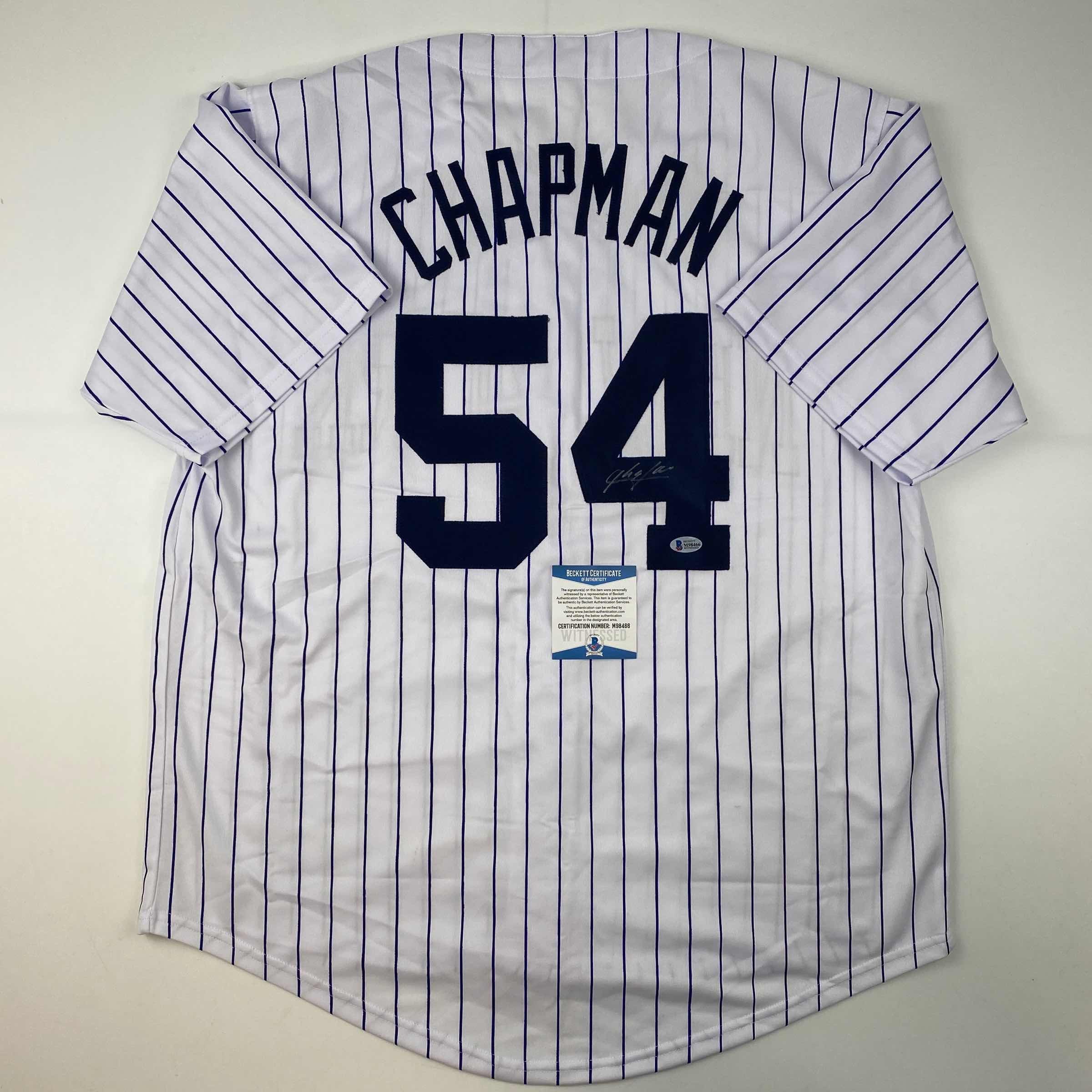 autographed-signed-aroldis-chapman-new-york-pinstripe-baseball-jersey-beckett-bas-coa