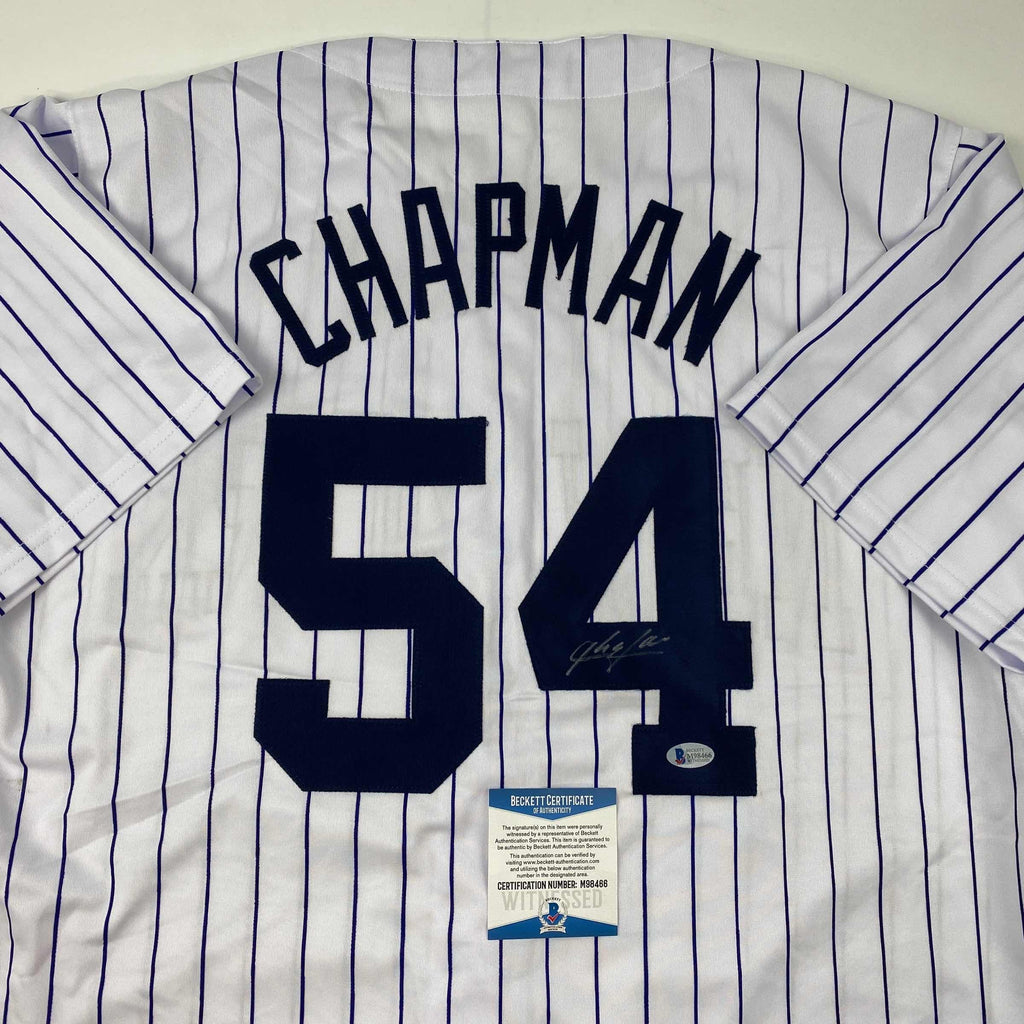 autographed-signed-aroldis-chapman-new-york-pinstripe-baseball-jersey-beckett-bas-coa