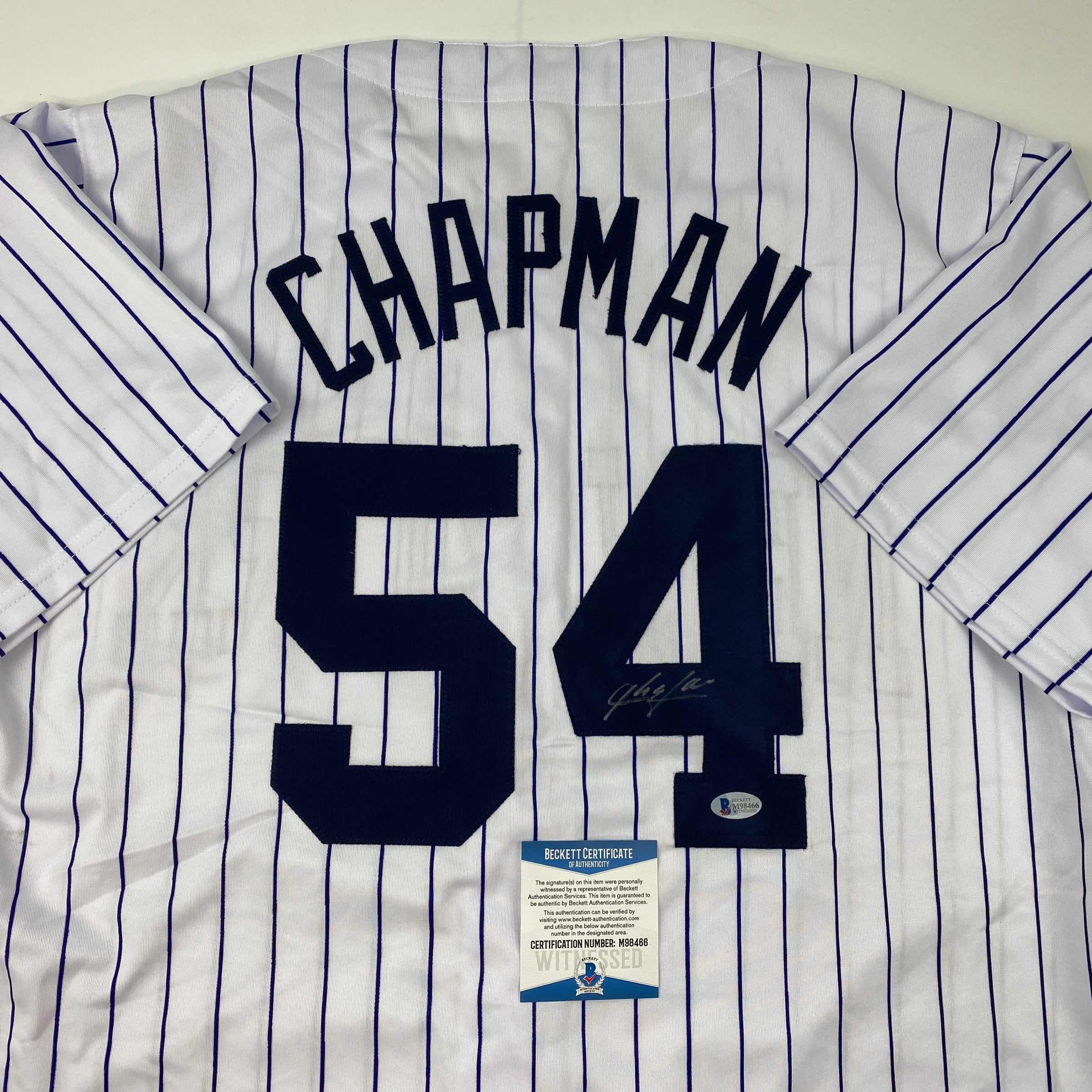 autographed-signed-aroldis-chapman-new-york-pinstripe-baseball-jersey-beckett-bas-coa
