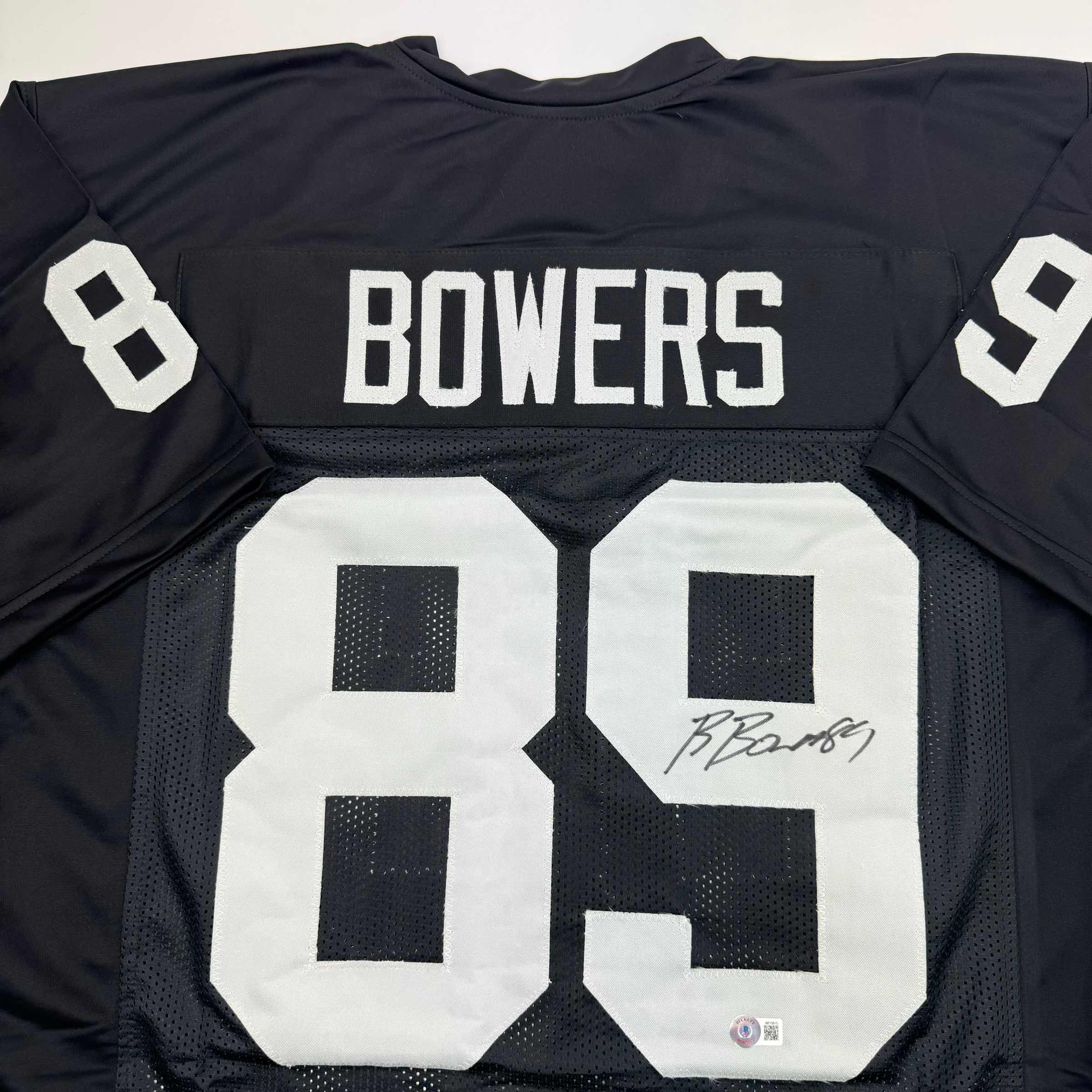 autographed-signed-brock-bowers-las-vegas-oakland-black-football-jersey-beckett-bas-coa
