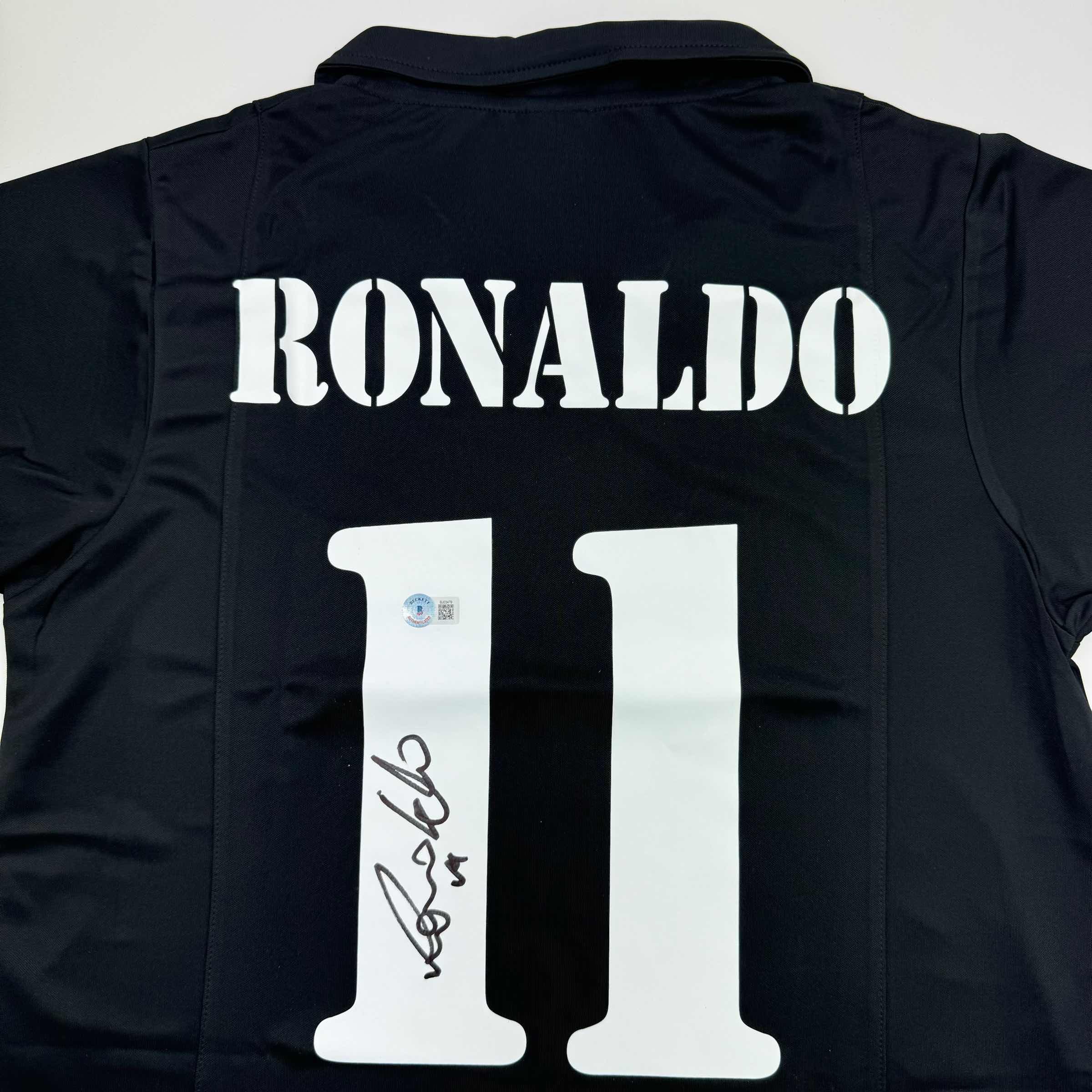 autographed-signed-ronaldo-nazario-real-madrid-black-soccer-jersey-beckett-bas-coa