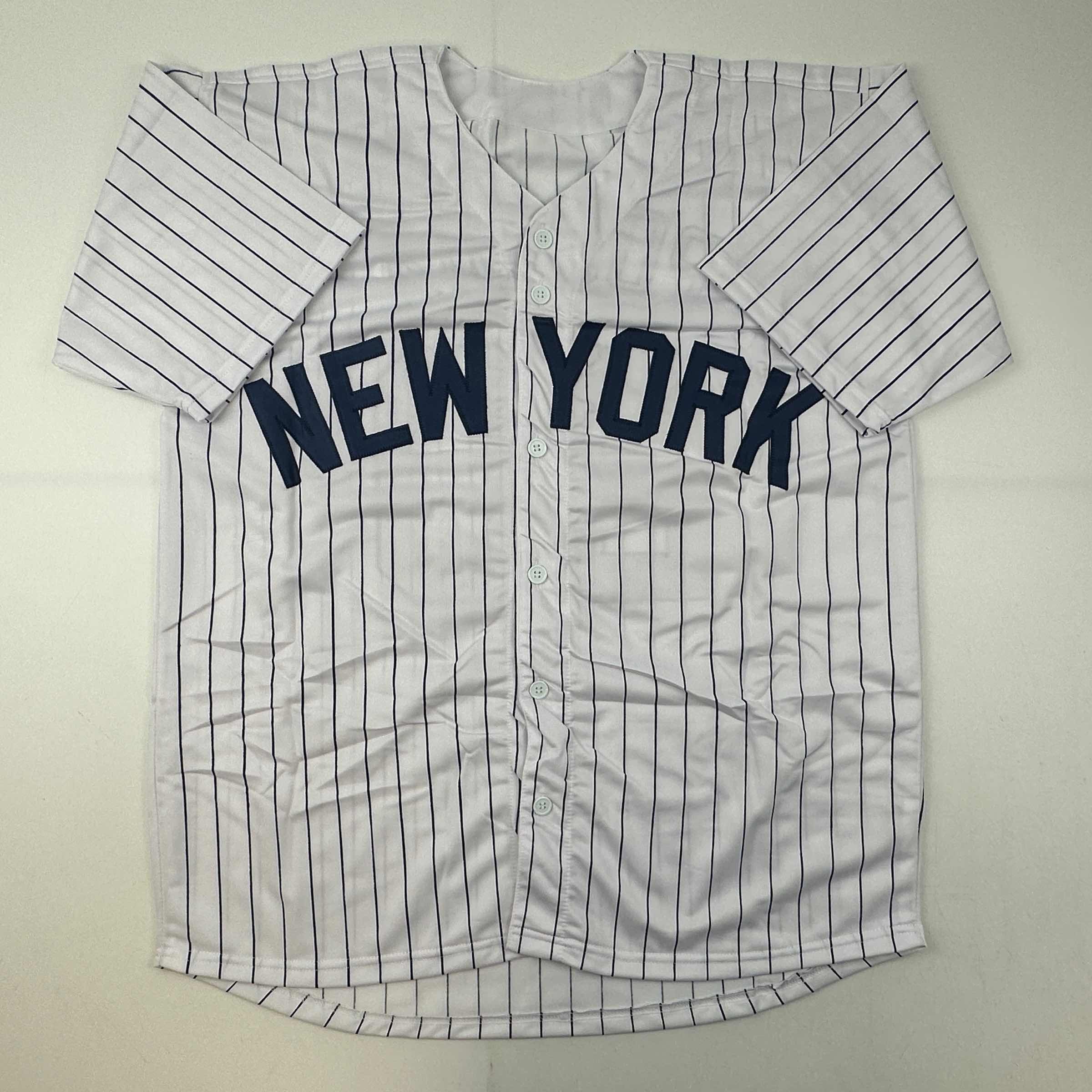 autographed-signed-jorge-posada-new-york-pinstripe-baseball-jersey-beckett-bas-coa