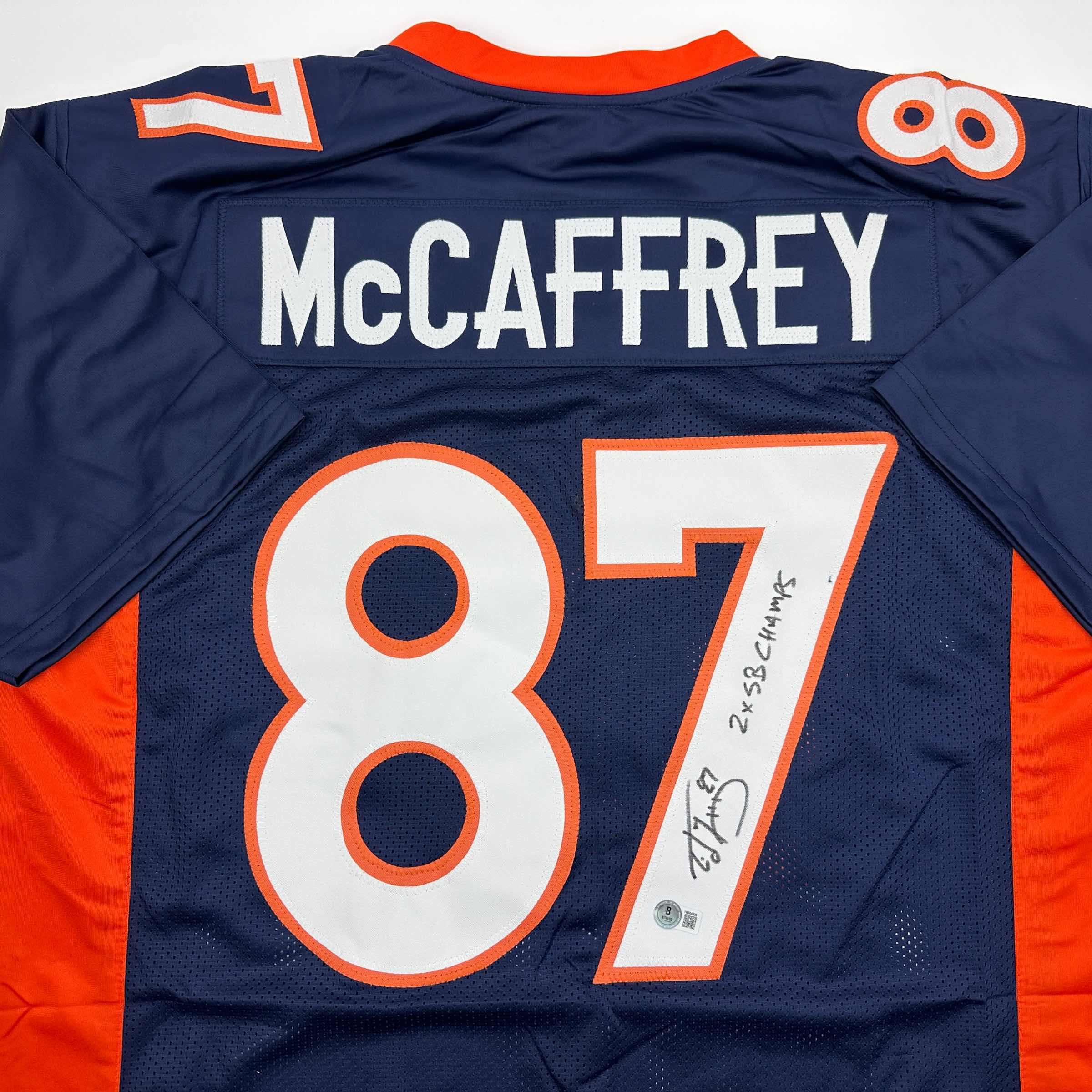autographed-signed-ed-mccaffrey-2x-sb-champs-denver-blue-football-jersey-beckett-bas-coa