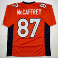 autographed-signed-ed-mccaffrey-2x-sb-champs-denver-orange-football-jersey-beckett-bas-coa