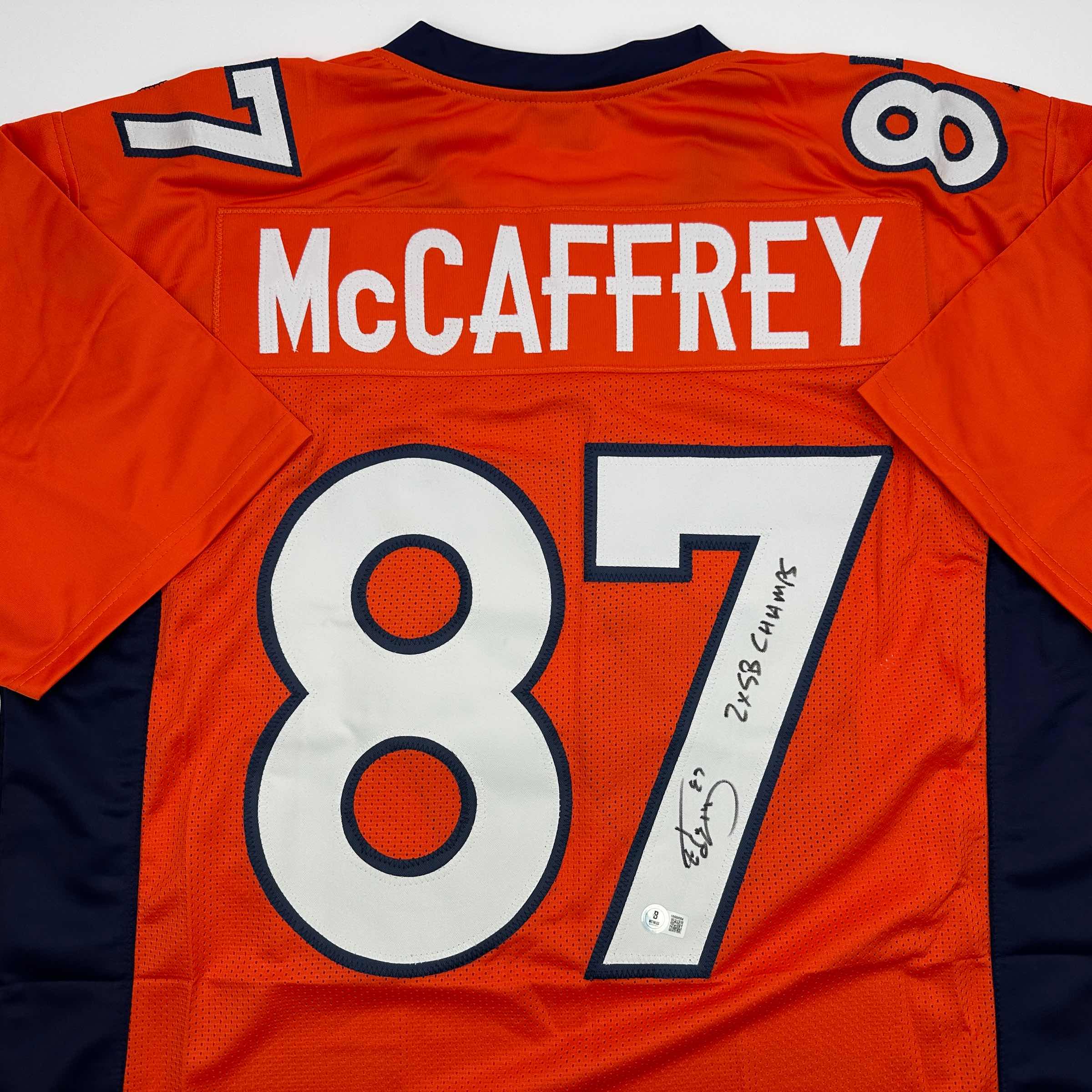 autographed-signed-ed-mccaffrey-2x-sb-champs-denver-orange-football-jersey-beckett-bas-coa