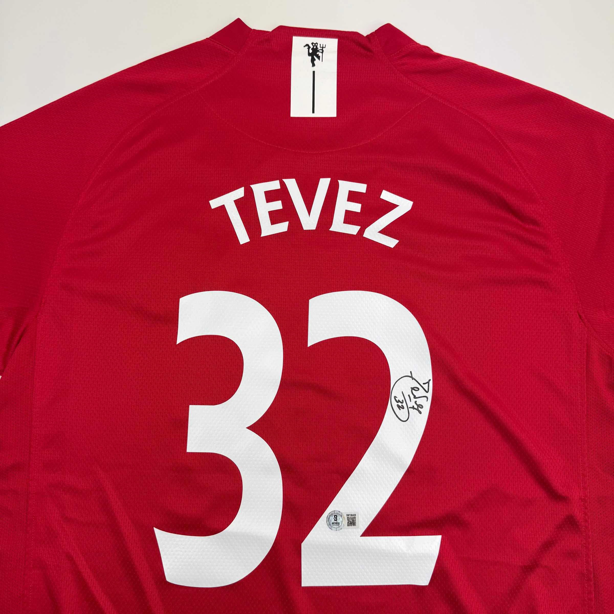 autographed-signed-carlos-tevez-manchester-united-red-soccer-jersey-beckett-bas-coa