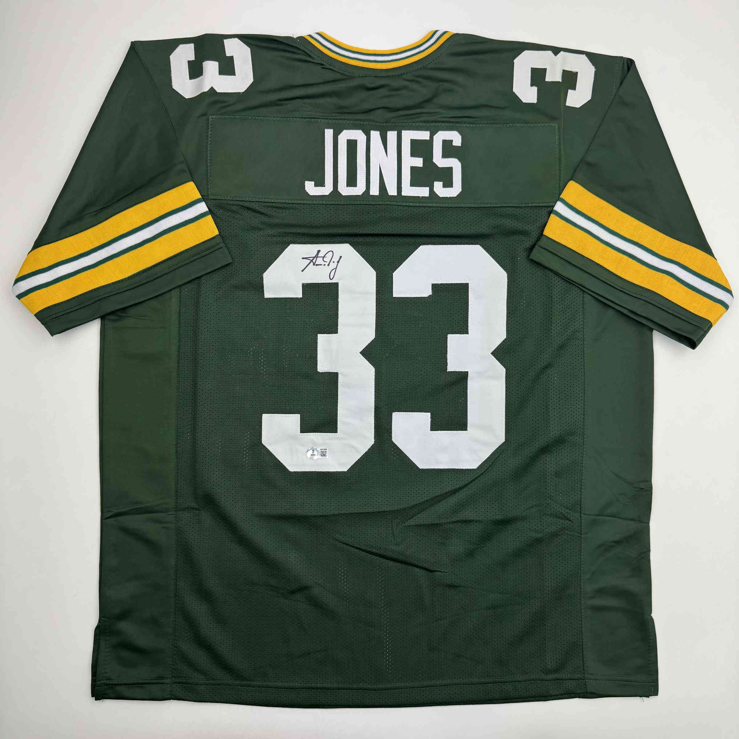 autographed-signed-aaron-jones-green-bay-green-football-jersey-beckett-bas-coa