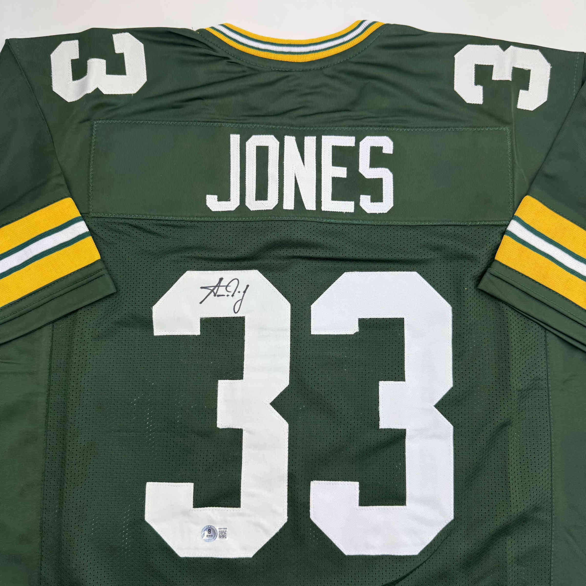 autographed-signed-aaron-jones-green-bay-green-football-jersey-beckett-bas-coa