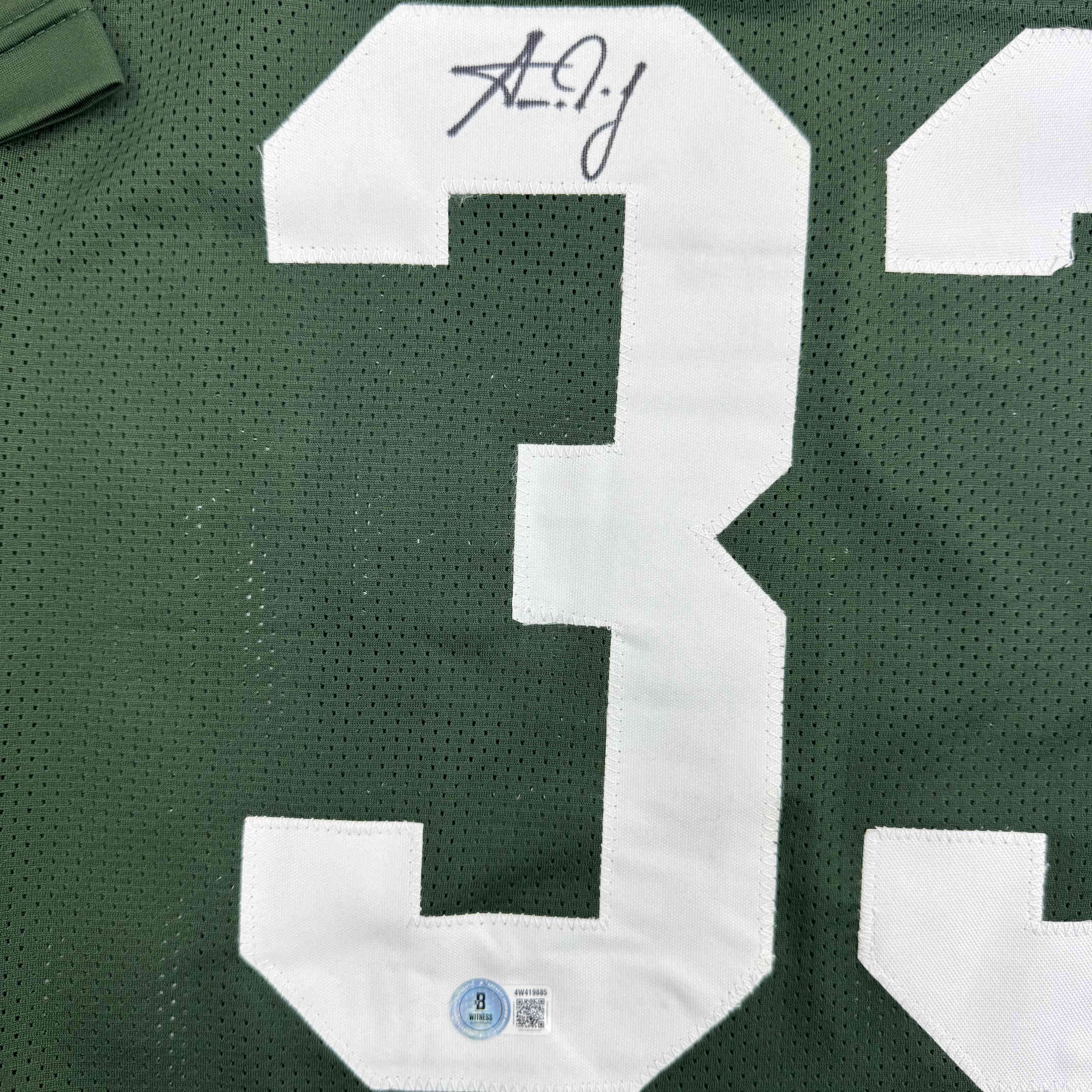 autographed-signed-aaron-jones-green-bay-green-football-jersey-beckett-bas-coa